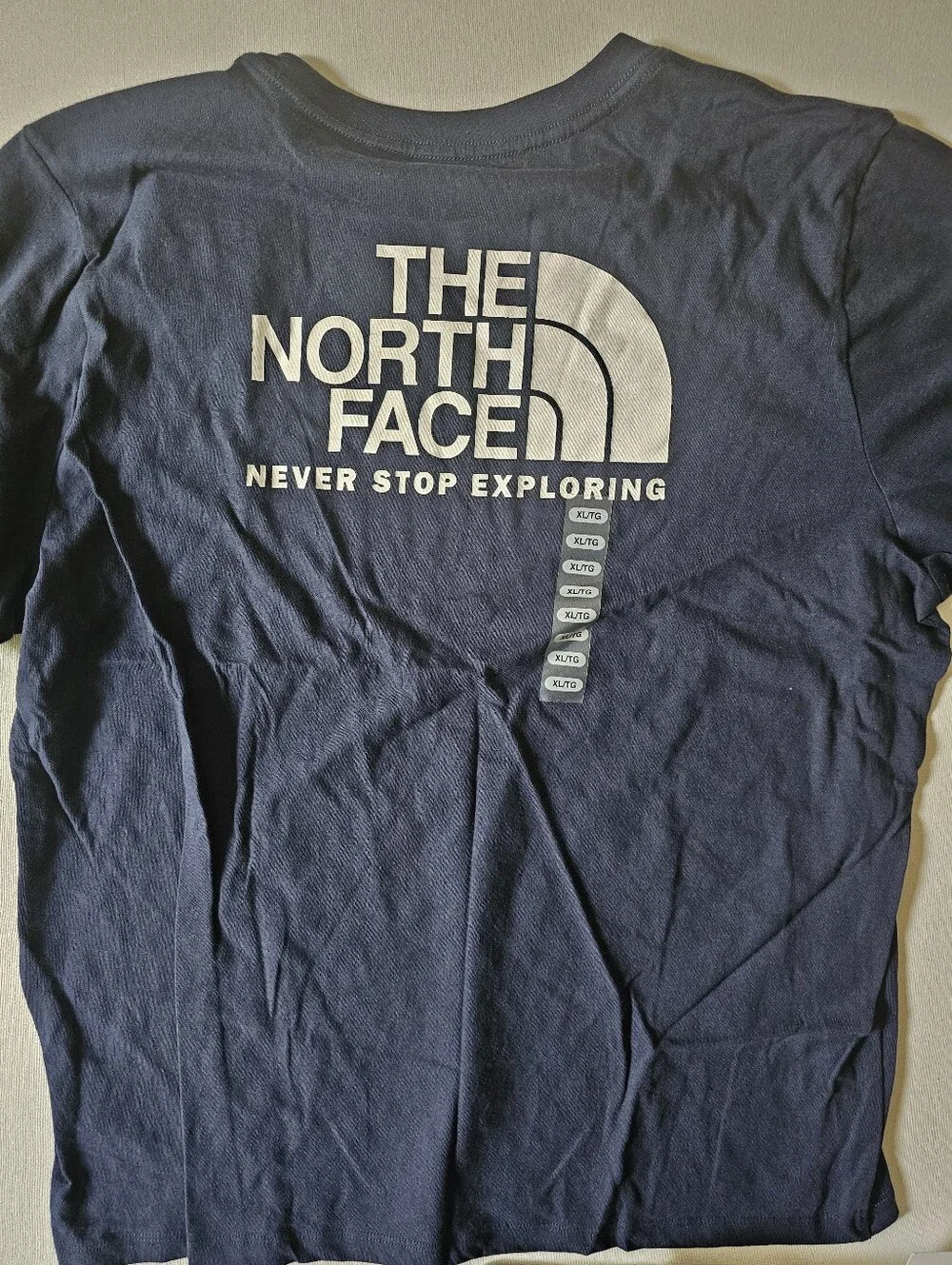 The North Face Standard Fit XL Dark Blue TShirt Never Stop Exploring Hiking New - Picture 4 of 5